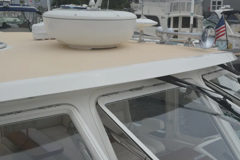 Slide: The Image of 2020 MJM 43z yacht roof with radar and horn, docked in marina. - 50