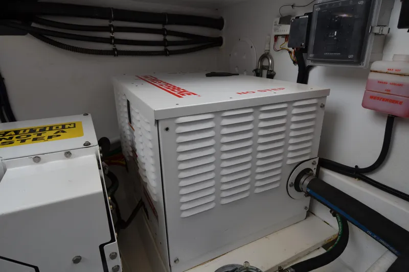 Slide: The Image of Engine room of 2020 MJM 43z boat with generator and control panel. - 51