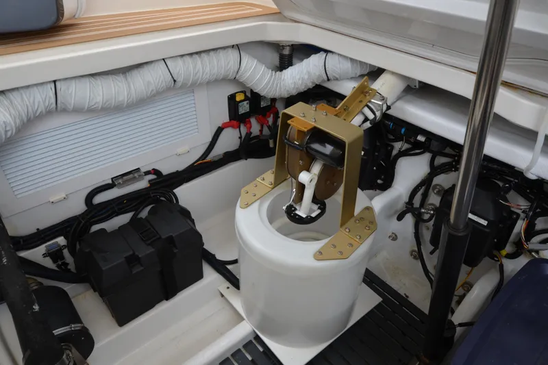 Slide: The Image of Engine compartment of 2020 MJM 43z boat, showcasing mechanical components and wiring. - 53