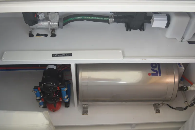 Slide: The Image of Engine compartment of 2020 MJM 43z boat with mechanical components and equipment. - 54