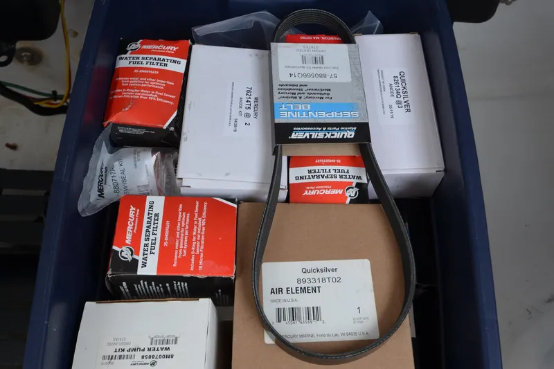 Slide: The Image of Box of MJM 43z 2020 boat parts, including filters and serpentine belt. - 55