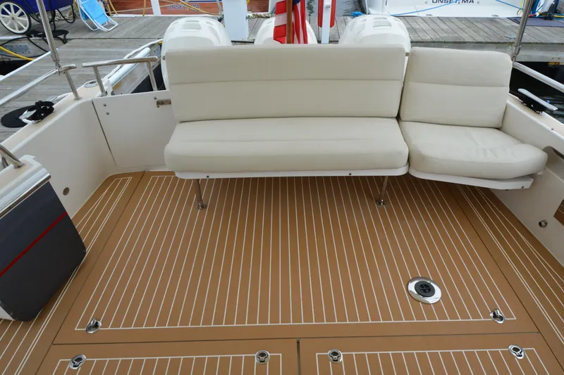 Slide: The Image of Luxury seating on 2020 MJM 43z boat deck with teak flooring. - 60