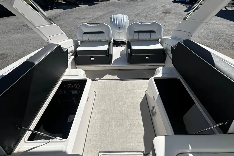 Slide: The Image of 2023 Regal LX6 boat interior with spacious seating and storage compartments. - 11