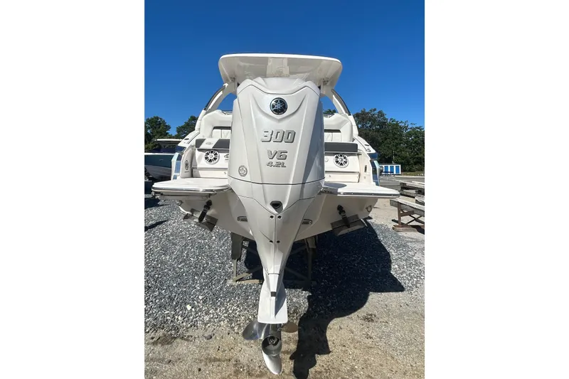 Slide: The Image of 2023 Regal LX6 boat with Yamaha 300 V6 engine, displayed outdoors. - 3