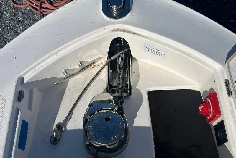 Slide: The Image of Anchor compartment of 2023 Regal LX6 boat with chain and winch system. - 4