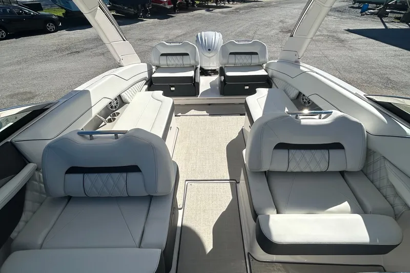Slide: The Image of 2023 Regal LX6 boat interior with luxurious seating and modern design. - 8