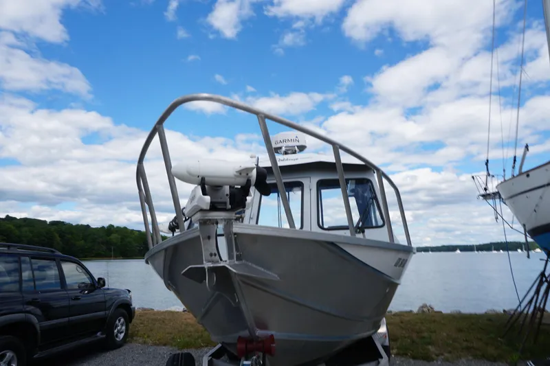 Slide: The Image of 2023 Weldcraft Ocean King 220 boat on trailer by a scenic lake. - 18