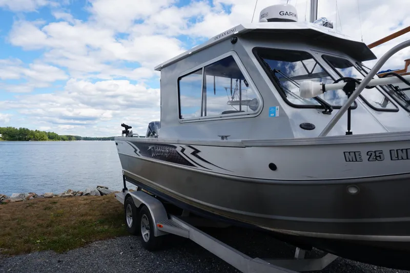 Slide: The Image of 2023 Weldcraft Ocean King 220 boat on trailer by a scenic lake. - 21