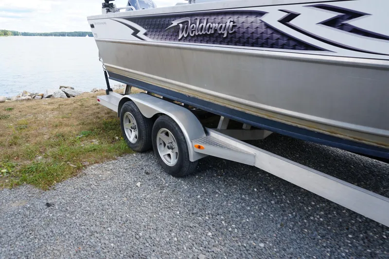 Slide: The Image of 2023 Weldcraft Ocean King 220 boat on trailer by lakeside. - 22