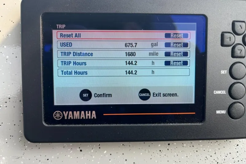 Slide: The Image of Yamaha display showing trip data: 675.7 gallons used, 1680 miles, 144.2 hours. Ocean King 220, 2023. - 3
