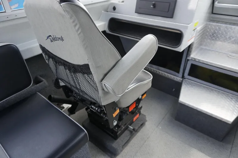 Slide: The Image of Captain's chair in 2023 Weldcraft Ocean King 220 boat interior. - 37