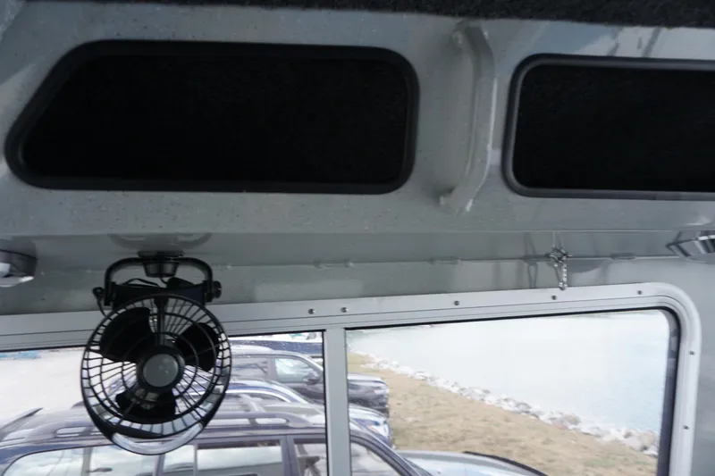 Slide: The Image of Interior of 2023 Weldcraft Ocean King 220 boat with fan and window view. - 42