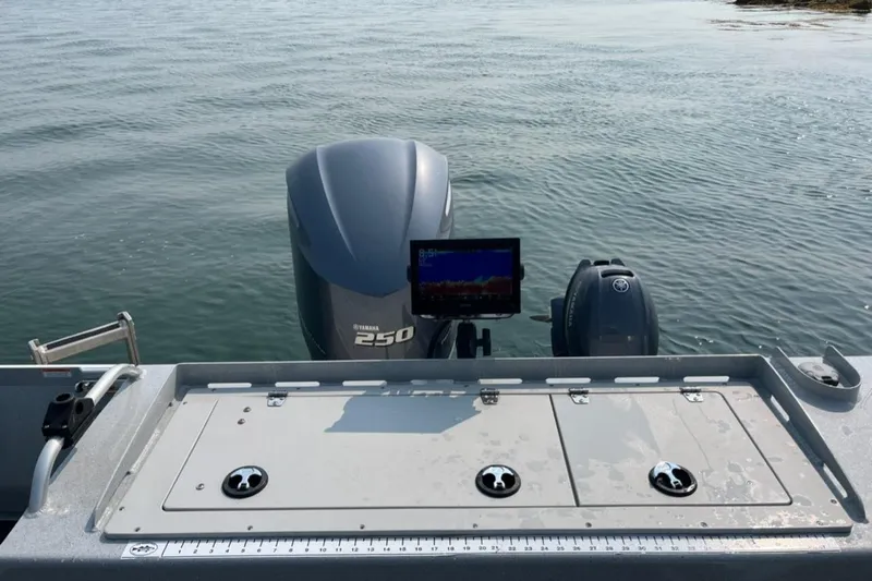 Slide: The Image of 2023 Ocean King 220 boat with Yamaha 250 engine on calm water. - 7