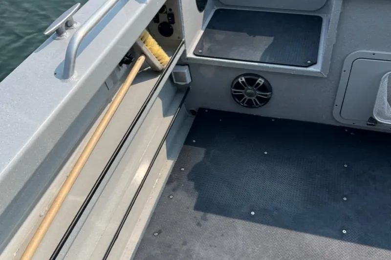 Slide: The Image of Interior of 2023 Ocean King 220 boat with storage and speaker. - 8