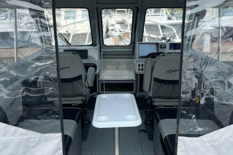 Slide: The Image of Interior of 2023 Ocean King 220 boat with seating and navigation equipment. - 1