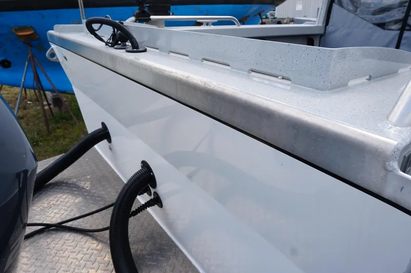 Slide: The Image of 2023 Weldcraft Ocean King 220 boat detail with hoses and metal surface. - 27