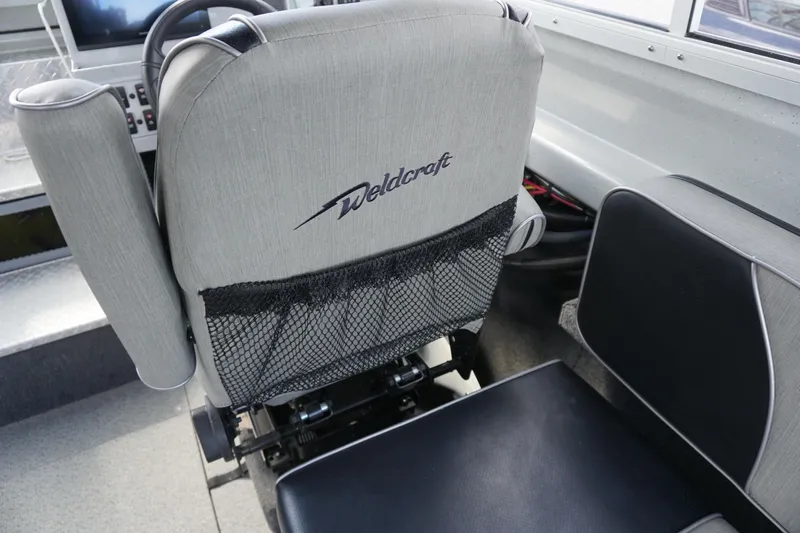 Slide: The Image of Captain's seat in 2023 Weldcraft Ocean King 220 boat interior. - 38