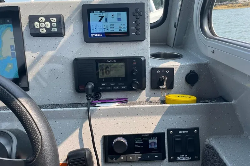 Slide: The Image of Control panel of 2023 Ocean King 220 boat with navigation and communication systems. - 4