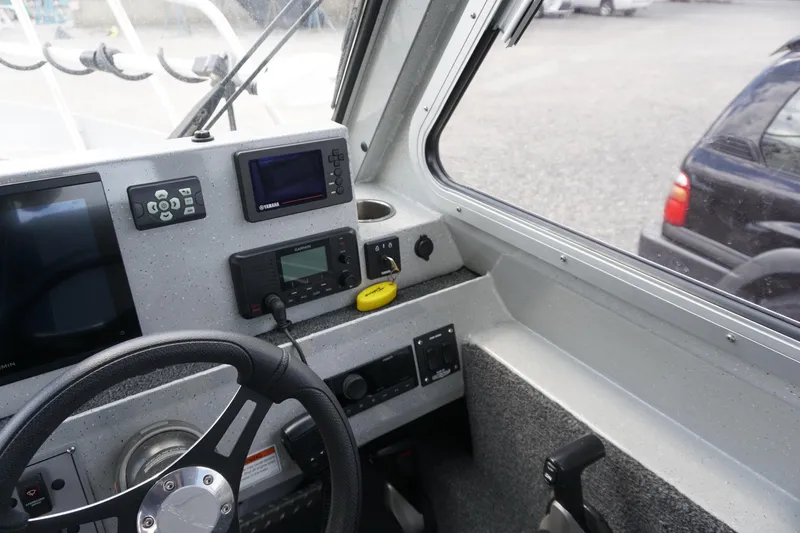 Slide: The Image of Interior view of 2023 Weldcraft Ocean King 220 boat cockpit with navigation equipment. - 40