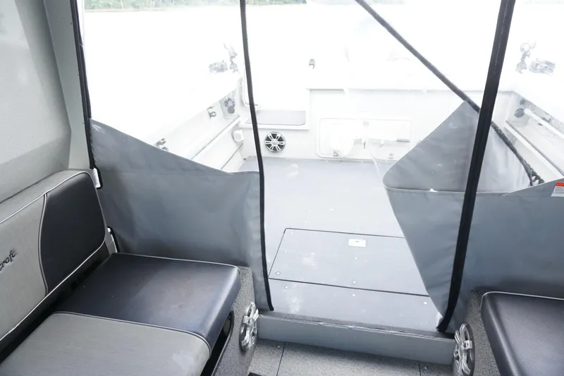 Slide: The Image of Interior view of 2023 Weldcraft Ocean King 220 boat, featuring seating and deck area. - 43