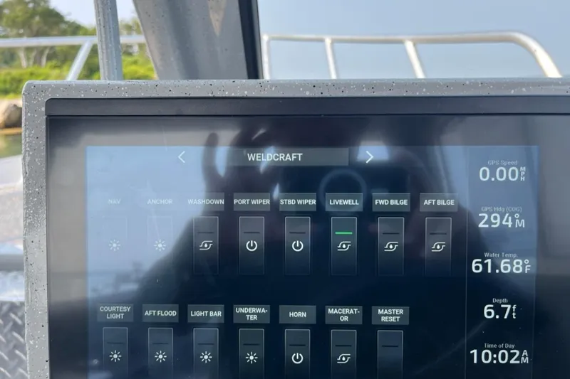 Slide: The Image of Touchscreen control panel on 2023 Ocean King 220 boat displaying navigation and system settings. - 5