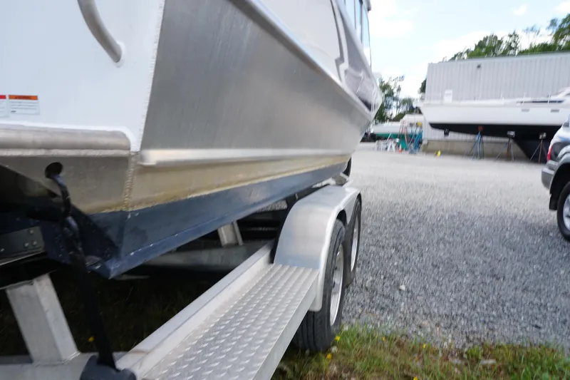 Slide: The Image of 2023 Weldcraft Ocean King 220 boat on trailer in a gravel lot. - 60