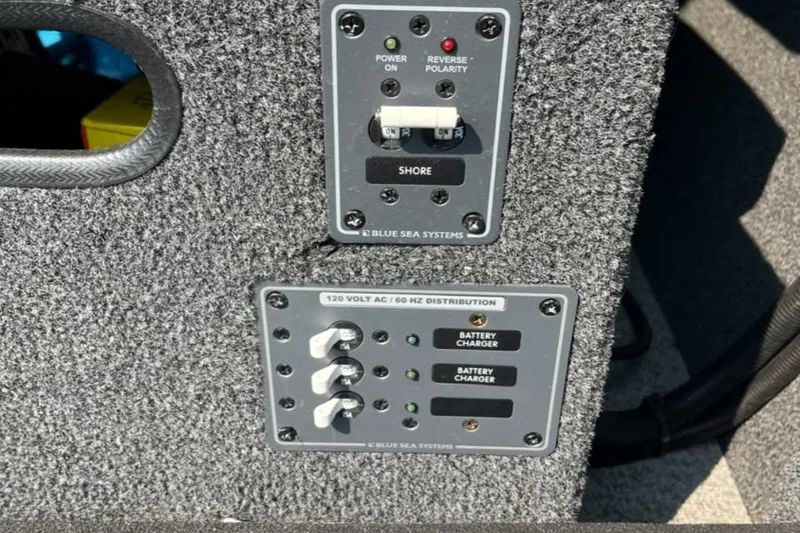 Slide: The Image of Control panel of 2023 Ocean King 220 boat with Blue Sea Systems switches. - 9
