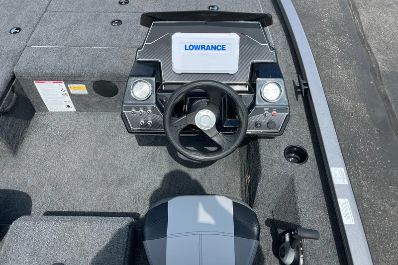 Slide: The Image of 2026 Crestliner XFC 179 boat dashboard with Lowrance display and steering wheel. - 4
