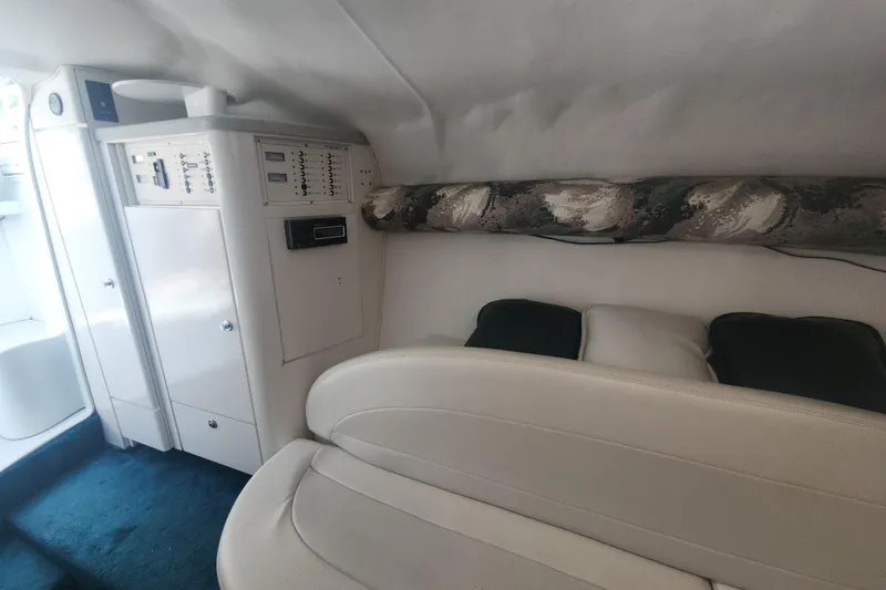 Slide: The Image of Interior of a 1999 Baja 38 Special boat with white seating and control panel. - 3