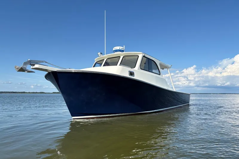 The Image of 2021 Composite Yacht CY32 Chesapeake on calm water under blue sky. - 0