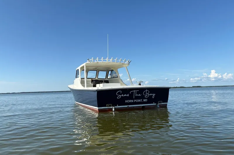 Slide: The Image of 2021 Composite Yacht CY32 Chesapeake on calm water under clear blue sky. - 3