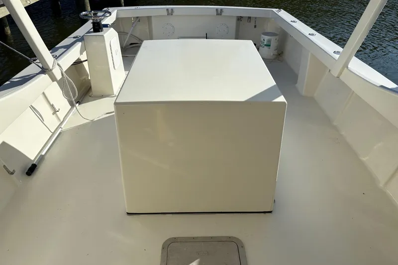 Slide: The Image of 2021 Composite Yacht CY32 Chesapeake deck with central console and seating area. - 8