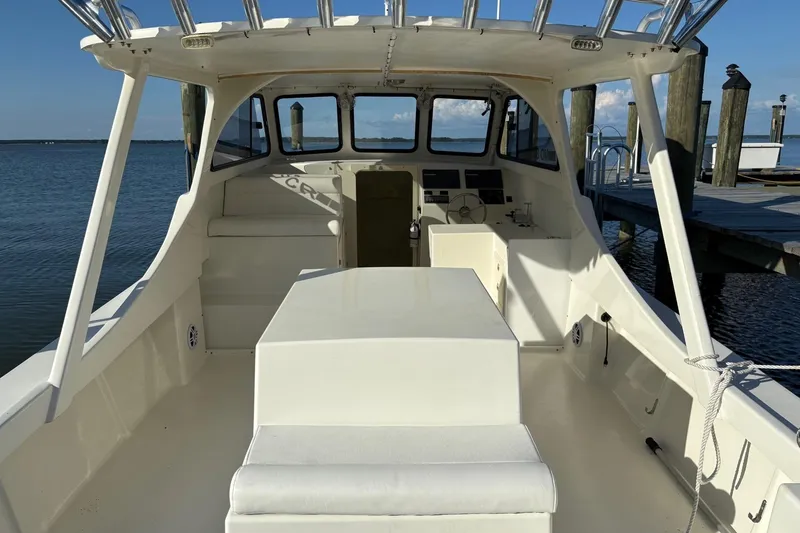 Slide: The Image of 2021 Composite Yacht CY32 Chesapeake, spacious deck, docked by calm waters. - 9