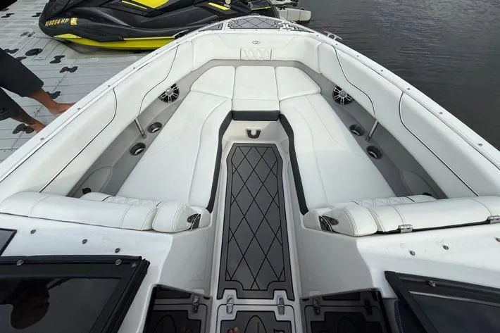 Slide: The Image of Luxurious 2021 Regal LS6 boat interior with white seating and sleek design. - 16