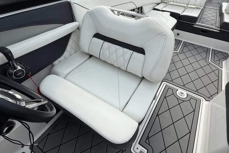 Slide: The Image of 2021 Regal LS6 boat interior with luxurious white seating and stylish flooring design. - 5