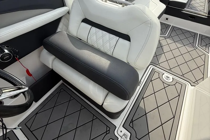 Slide: The Image of 2021 Regal LS6 boat interior with luxurious seating and stylish flooring design. - 6