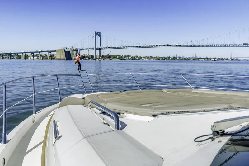 Slide: The Image of 2014 Sunseeker 68 Sport Yacht cruising near a bridge on a sunny day. - 14