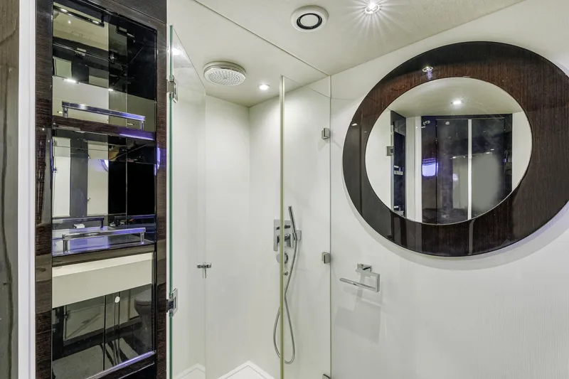 Slide: The Image of Luxurious bathroom interior of 2014 Sunseeker 68 Sport Yacht with modern fixtures and round mirror. - 25