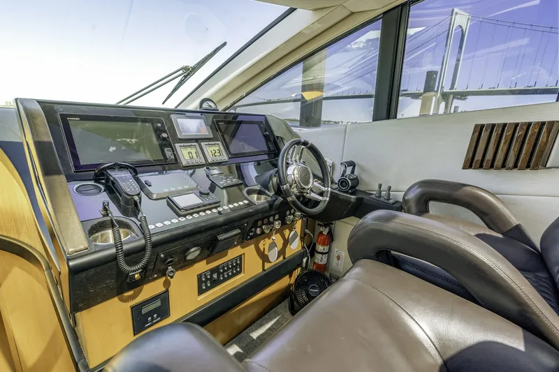 Slide: The Image of Interior helm of 2014 Sunseeker 68 Sport Yacht with modern navigation equipment. - 28