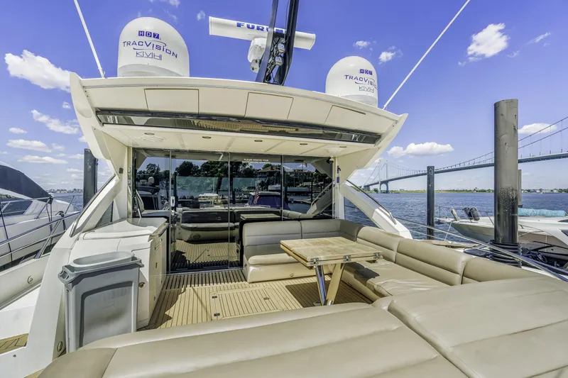 Slide: The Image of Luxurious 2014 Sunseeker 68 Sport Yacht with spacious deck and seating area. - 34