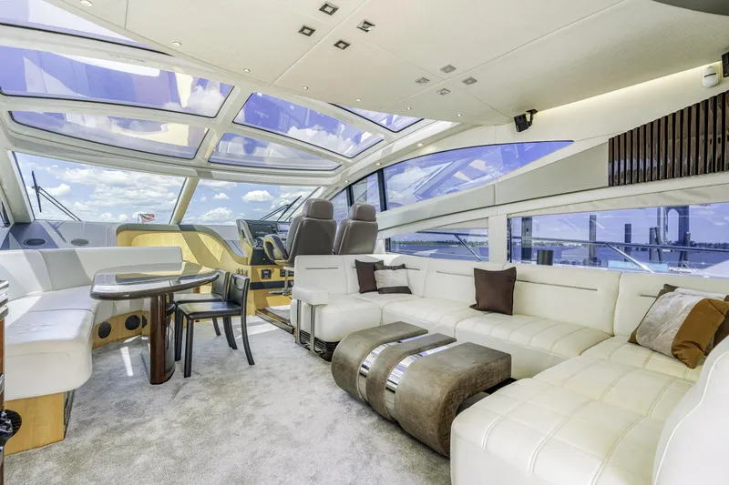Slide: The Image of Luxurious interior of 2014 Sunseeker 68 Sport Yacht with panoramic windows and elegant seating. - 35
