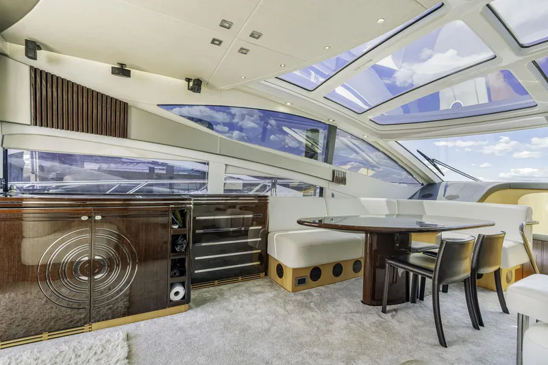 Slide: The Image of Luxurious interior of 2014 Sunseeker 68 Sport Yacht with elegant dining area and panoramic windows. - 36