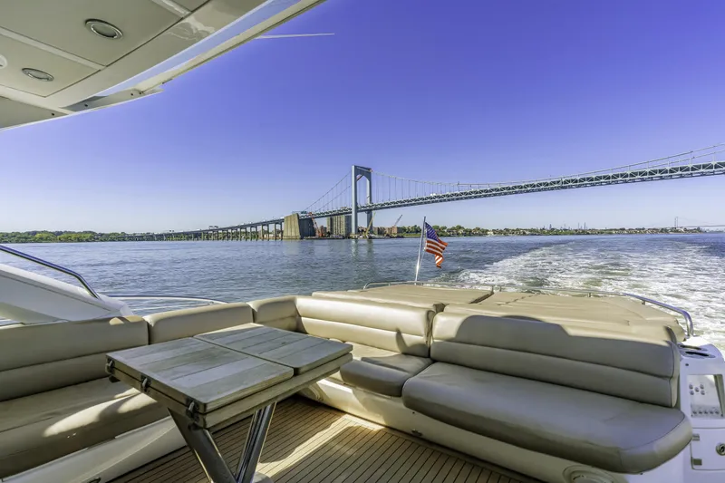 Slide: The Image of Luxurious 2014 Sunseeker 68 Sport Yacht cruising under a scenic bridge. - 7