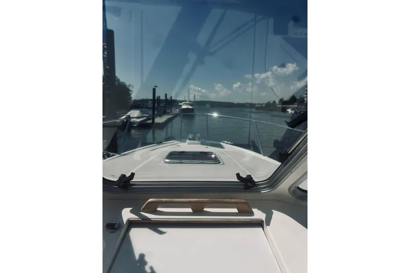 Slide: The Image of View from 2013 Back Cove 30 boat cockpit, overlooking marina and calm waters. - 13