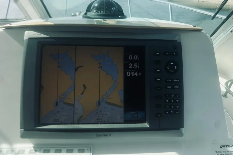 Slide: The Image of Garmin navigation system on 2013 Back Cove 30 boat, displaying nautical chart. - 38