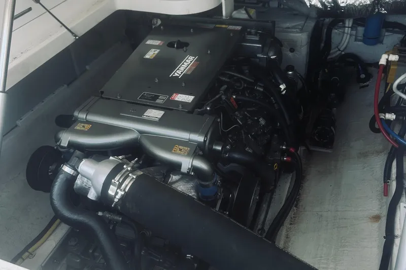 Slide: The Image of Engine compartment of a 2013 Back Cove 30 boat featuring a Yanmar engine. - 39