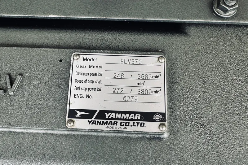 Slide: The Image of Yanmar engine plate on 2013 Back Cove 30, model 8LV370, showing power specifications. - 41