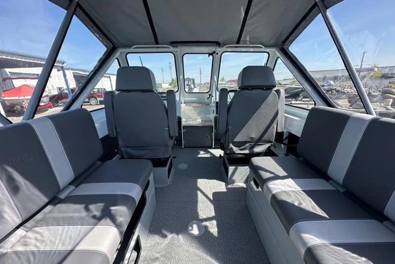 Slide: The Image of Interior of 2025 Hewescraft 190 Sea Runner ET boat with seating and helm. - 6