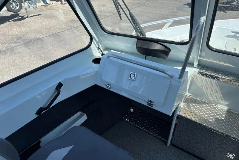 Slide: The Image of Interior of 2025 Hewescraft 190 Sea Runner ET boat, featuring seating and storage. - 8