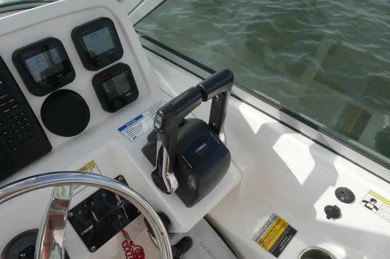 Slide: The Image of Control panel of 2014 Carolina Cat 23DC boat with Yamaha throttle and gauges. - 26